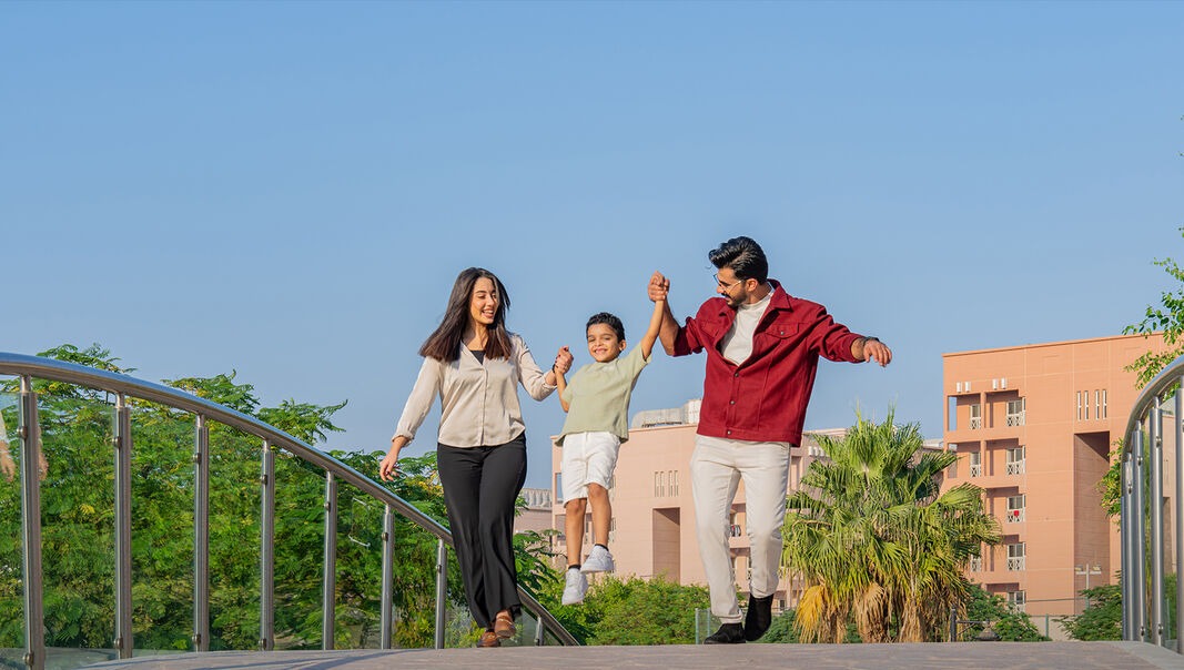 Family enjoying Mesaimeer City outdoor spaces