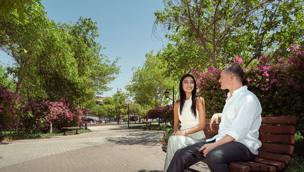 Residents relaxing in a landscaped park